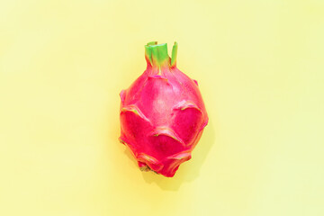 Dragon fruit or pitahaya (pitaya) isolated on yellow background. Top view