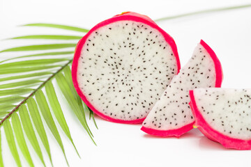 Slices dragon fruit, Pitaya or Pitahaya with leaf on white background. Top view. Flat lay