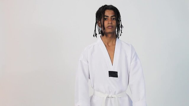 V&iacute;deo of lat&iacute;n teen  braids with taekwondo uniform isolated 