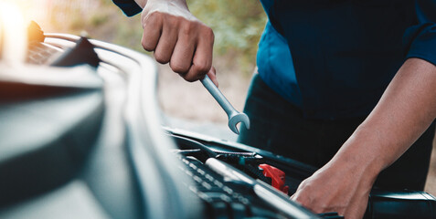Mechanic open vehicle hood checking up auto mobile, fixing a car at home,Repair and service