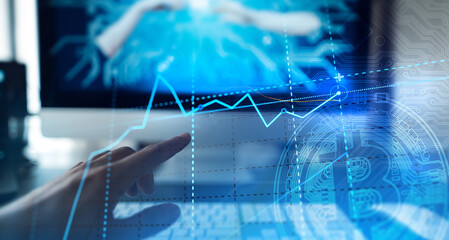 Golden bitcoins. Cryptocurrency on computer desk and Double Exposure chart