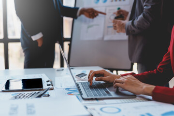 Businessmen meeting to show business graph growth and stock market investment plan