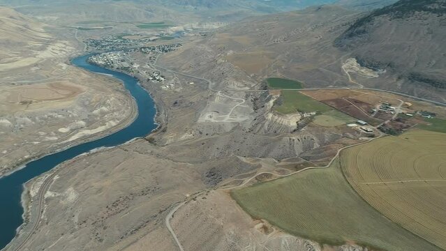 aerial view to Indus river and valley, Karakoram, Pakistan. Nice view of the valley, Sarayan village, agricultural fields in the mountainous landscape.