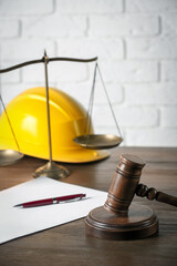 Labour, construction and land law concepts. Judge gavel, scales of justice, protective helmet,...