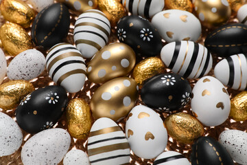 Many festively decorated Easter eggs as background