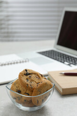 Chocolate chip cookies on light gray table in office