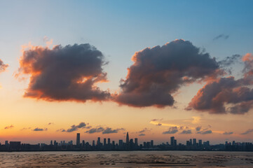 Panorama of skyline of Shenzhen city, China under sunset. Viewed from Hong Kong border