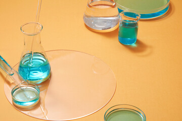 Blue liquid contained inside laboratory glassware with empty area for text or product presentation....