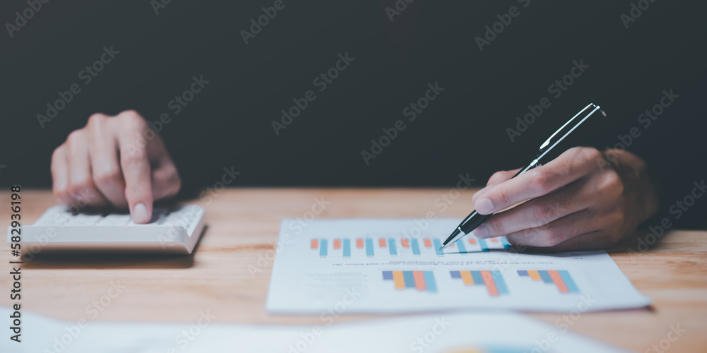 Poster Businessman reading graph report and business statistics charts ,Analysis and improvement of corporate strategy ,financial and marketing documents , Statistics and Data Concepts ,business growth graph
