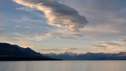 New Zealand landscape with mountains and lake with dramatic sky