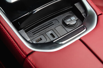 Fototapeta na wymiar Close up of a charging in the car, usb connector . modern car interior
