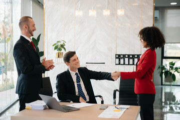 business people shaking hands during a meeting in office.