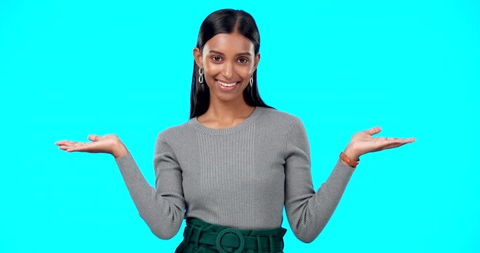 Choice, option or decision and a woman on a blue background in studio with a hand gesture. Portrait, balance and scale with an attractive young female weighing up the pros and cons of a variable