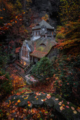 Hresko, Czech Republic - Lovely stone cottage in the Czech woods near Hresko at autumn with colorful fall leaves and foliage