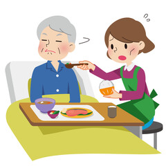 おじいさんの介護に疲れる女性