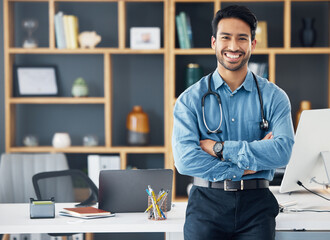 Fototapeta na wymiar Portrait, Asian man and doctor with arms crossed, healthcare and confident in workplace. Face, Japanese male employee and happy medical professional with leadership, skills and management in office