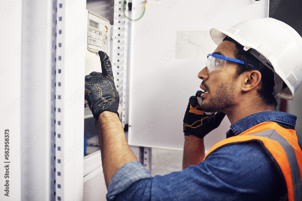 Wall mural Man, phone call and engineering in control room, switchboard or industrial system inspection. Male electrician talking on smartphone at power box, server mechanic or electrical substation maintenance