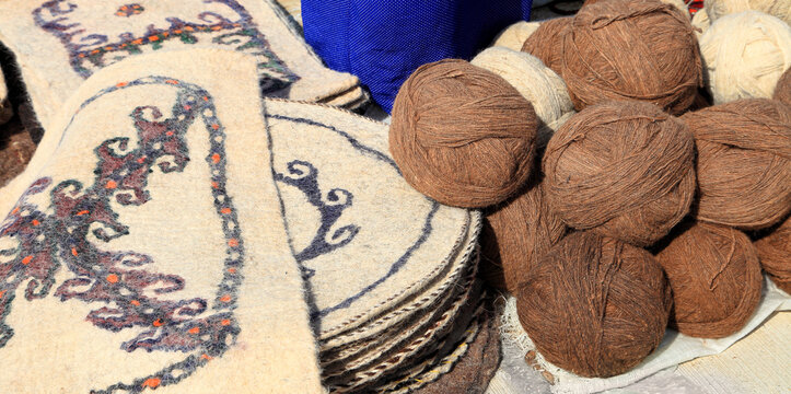 Felt rugs and balls of camel wool. Turkmenistan. Ashkhabad market.