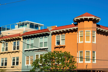 Fototapeta na wymiar Colorful row apartment buildings or townhomes in downtown city san francisco historic districts downtown neighborhood