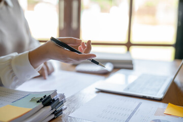 Small business accounting Businesswoman Accountant verify growing business with calculator. Accountancy Concept.