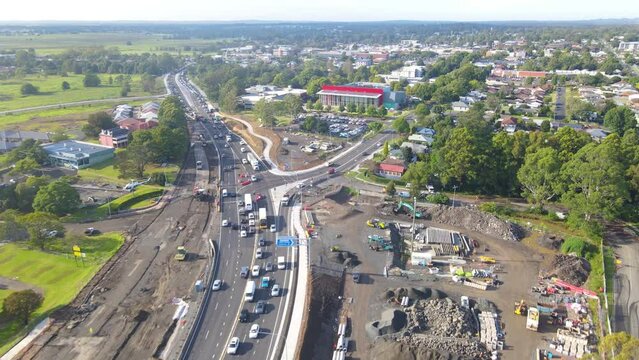 Aerial drone pullback reverse view of Nowra Bridge crossing Shoalhaven River along the Princes Highway in Nowra in the City of Shoalhaven, NSW, Australia 
