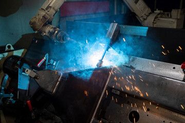 Industrial welding robot. Robot coded to weld is working. Digital production operation. Industry 4.0