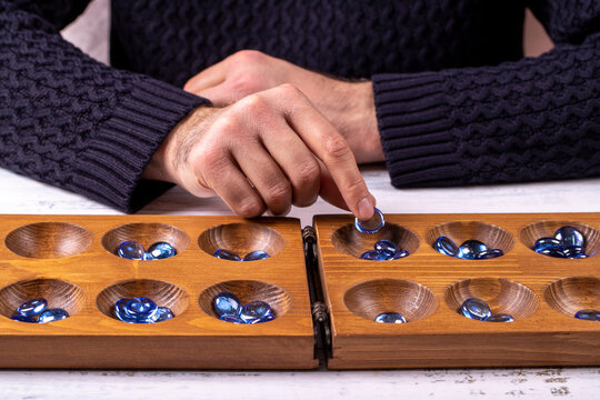 Mangala game board and glass marbles. Historical Turkish game mangala