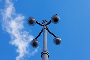 Fototapeta na wymiar old metal street lamp with four lights