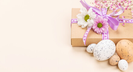 Gift box, Easter eggs and flowers