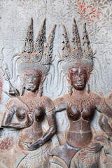 Wall carving -  apsara dancers, famous Angkor Wat complex, Siem Reap, Cambodia. UNESCO world heritage site