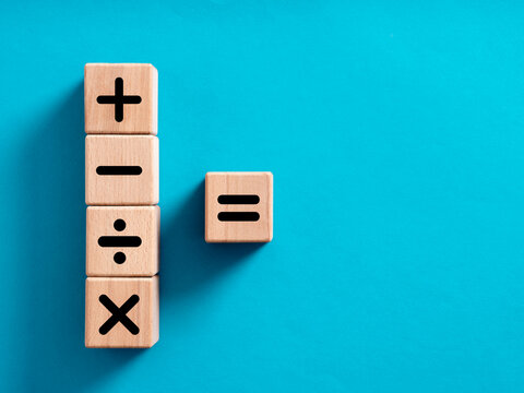 Basic Mathematical Operations Symbols. Plus, Minus, Multiply, Divide And Equal Symbols On Wooden Cubes.