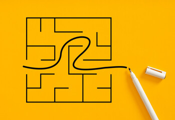 Pen draws a solution line on a maze. Successful business solution for business problems. Problem...