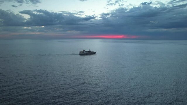 Ship at sunset on the high seas
