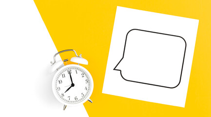 White alarm clock and speech bubble on yellow background, flat lay.