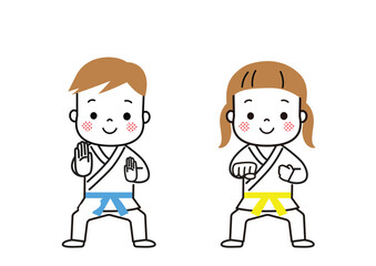 空手　道着を着てポーズをとっている男の子と女の子