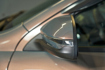 side rearview mirror with turn signal repeater on pearl gray car