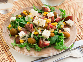 fresh vegetarian healthy vegetable salad with arugula and chees