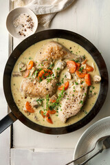 French chicken fricassee. sauté chicken slow cooked in a creamy white sauce with mushroom and carrot
