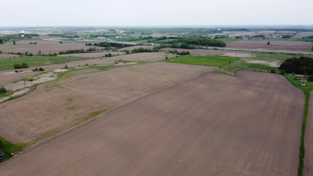 Drone flying over farmers fields in rural East Gwillimbury outside of Toronto.