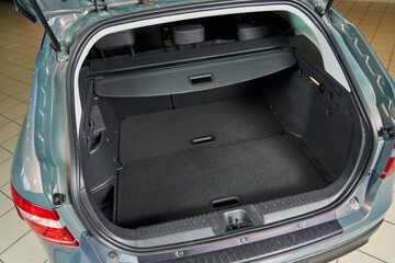 large roomy car trunk with internal compartments, shelves, ceilings