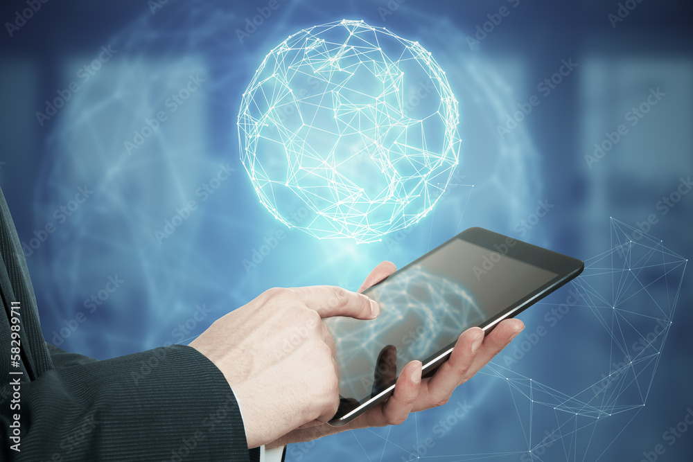 Poster Close up of man hand pointing at mobile phone with glowing polygonal globe hud on blurry background. Futuristic technology wireframe mesh polygonal element. Social Network Graphic Concept.