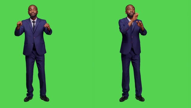 African american man having choir concert for opera event, conducting symphony standing over greenscreen backdrop. Male musician choirmaster playing formal music, modern conductor.