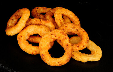 Group of crispy battered fried French onion rings
