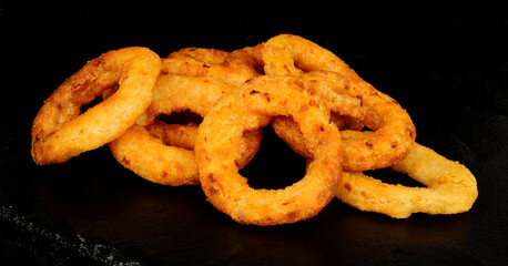 Group of crispy battered fried French onion rings