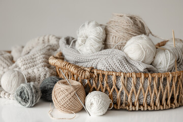 Basket with yarn close-up, threads for knitting.
