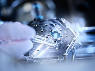 Electronic chip on silver colored semiconductor in laboratory