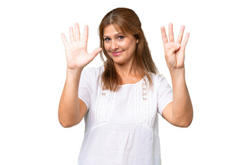 Middle-aged caucasian woman over isolated background counting nine with fingers