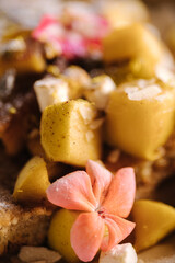 Homemade french toast sticks with marshmallows, powdered sugar and caramelised pear. Macro photo. Flower 