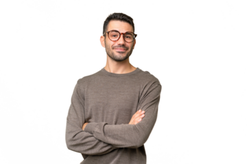 Young handsome caucasian man over isolated background with arms crossed and looking forward