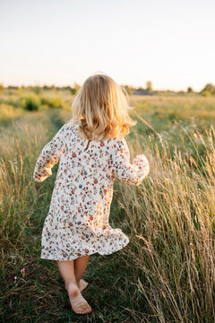 Carefree girl running on field